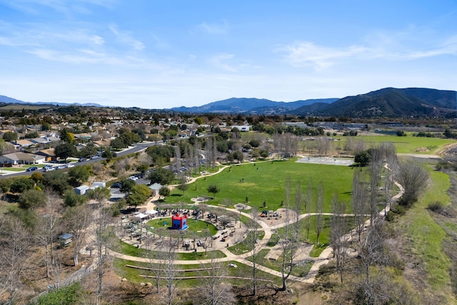 birds eye view of property with a mountain view