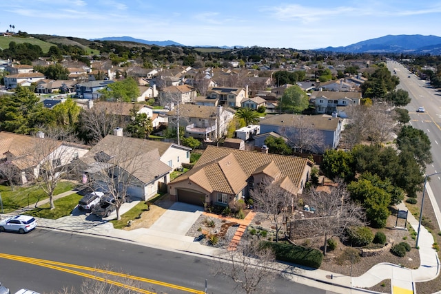 drone / aerial view with a mountain view and a residential view