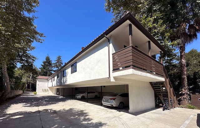 view of side of home with a carport