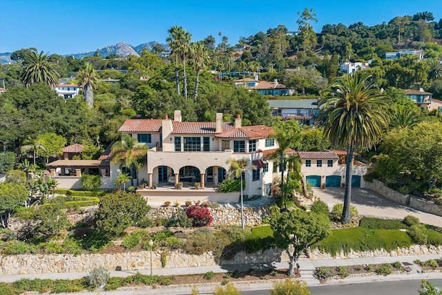 birds eye view of property with a mountain view