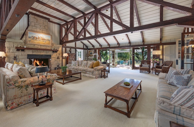 carpeted living room with beamed ceiling, wood ceiling, a fireplace, and high vaulted ceiling