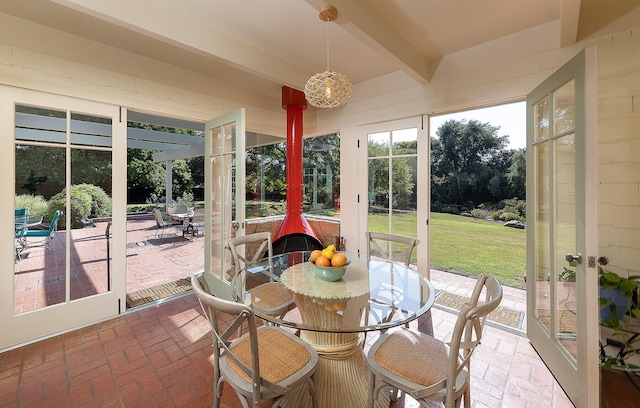 sunroom with beamed ceiling