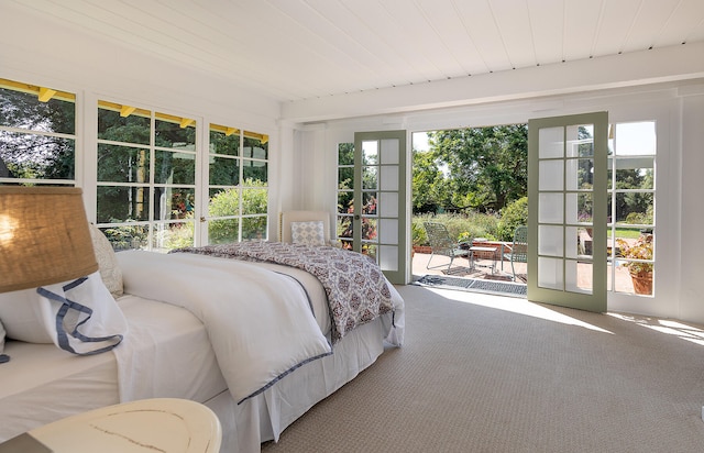 carpeted bedroom featuring french doors, access to outside, and wooden ceiling