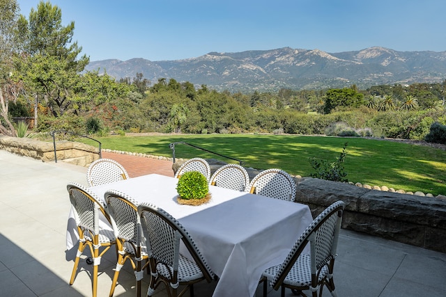 view of patio / terrace featuring a mountain view