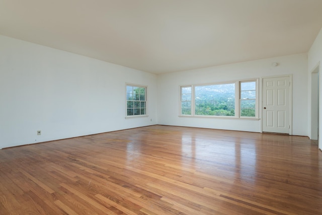 unfurnished room with light hardwood / wood-style flooring