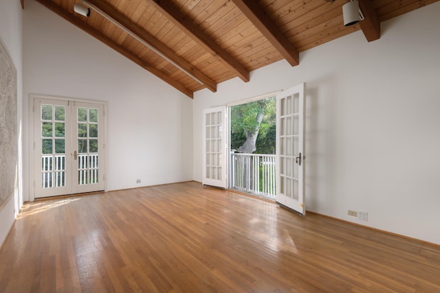 unfurnished room featuring hardwood / wood-style floors, french doors, high vaulted ceiling, and wooden ceiling