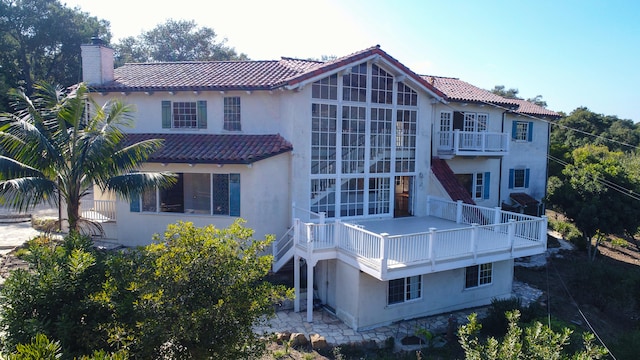 exterior space with a patio area and a balcony