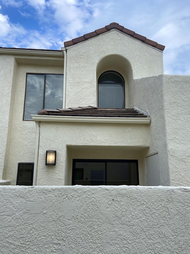 exterior space with fence and stucco siding