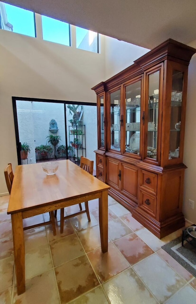 dining area with light tile patterned floors