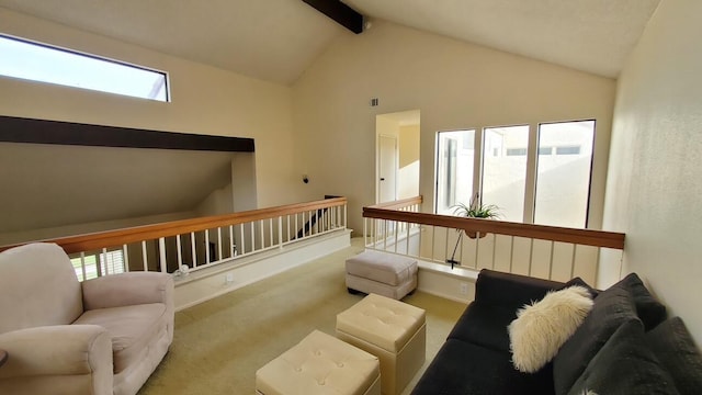 living area featuring visible vents, carpet flooring, beam ceiling, and a healthy amount of sunlight