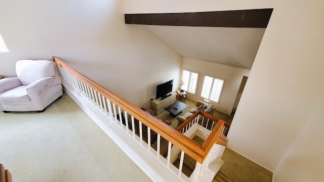 interior space featuring high vaulted ceiling, carpet flooring, and beamed ceiling