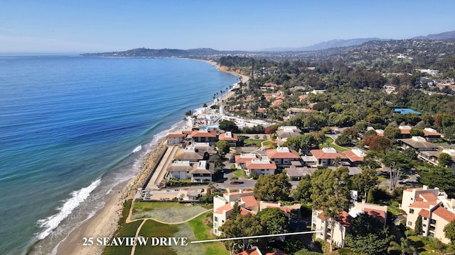 aerial view featuring a view of the beach and a water view