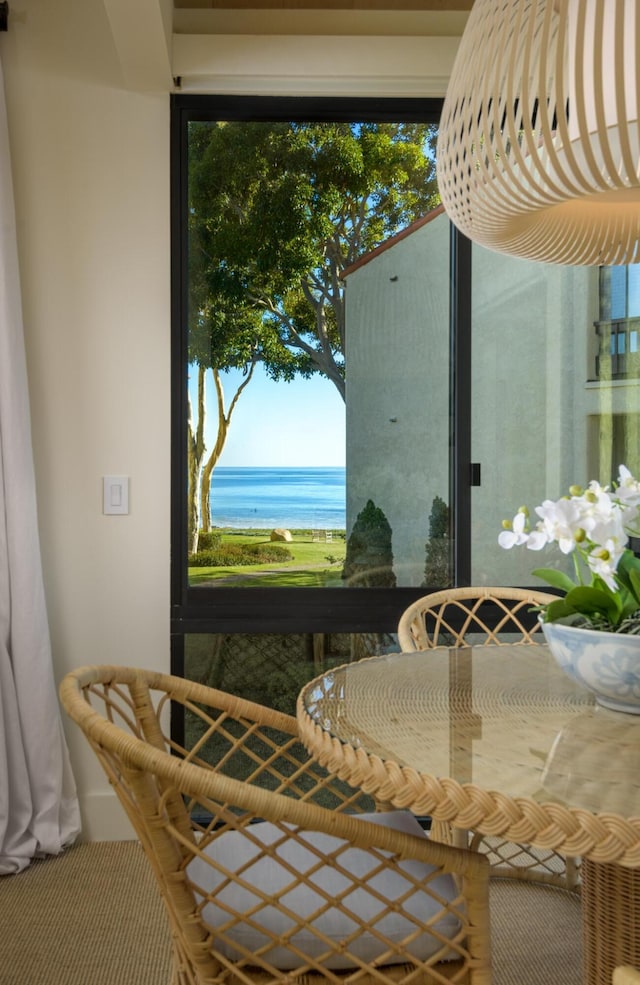 unfurnished dining area featuring a water view