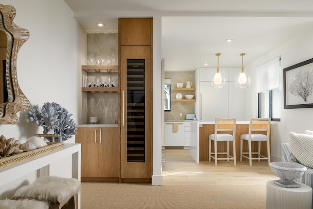 bar with decorative backsplash and pendant lighting