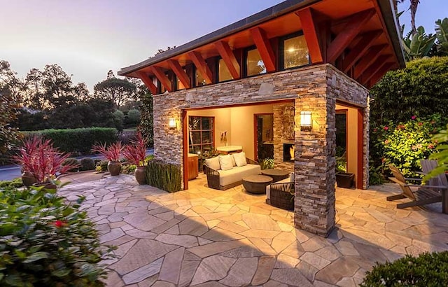 patio terrace at dusk with an outdoor hangout area