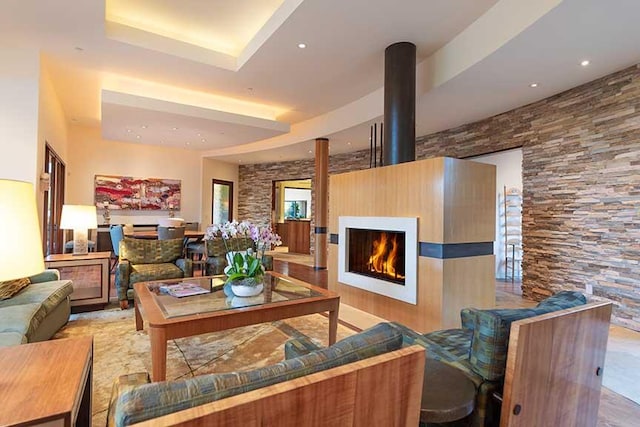 living room featuring a tray ceiling