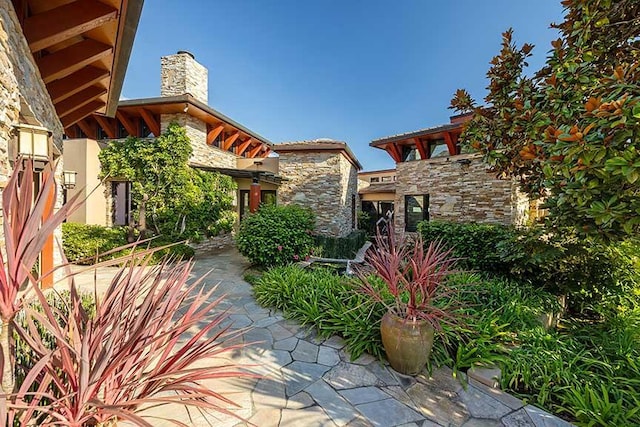 434 Crocker Sperry Dr, Montecito, CA 93108 - view of front of house with a chimney and stone siding