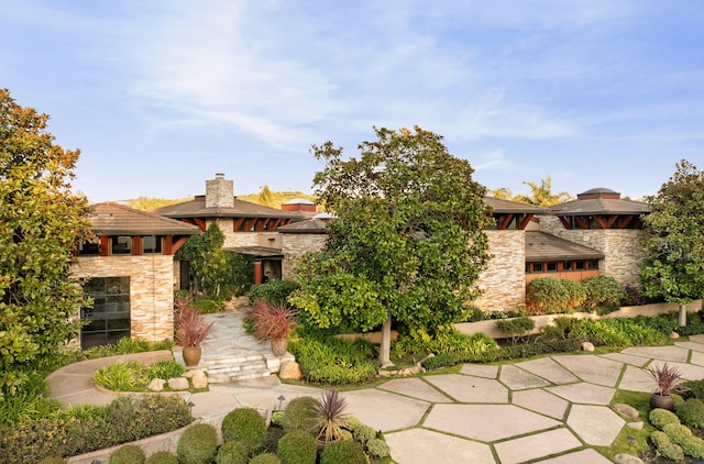 434 Crocker Sperry Dr, Montecito, CA 93108 - prairie-style house featuring a chimney and stone siding