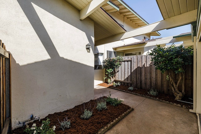 view of property exterior with a patio