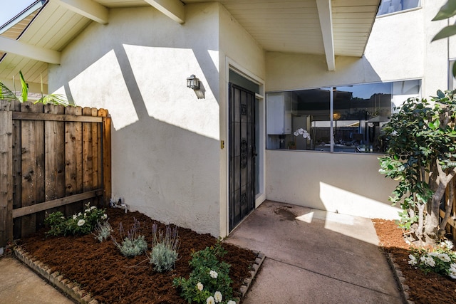 doorway to property featuring a patio