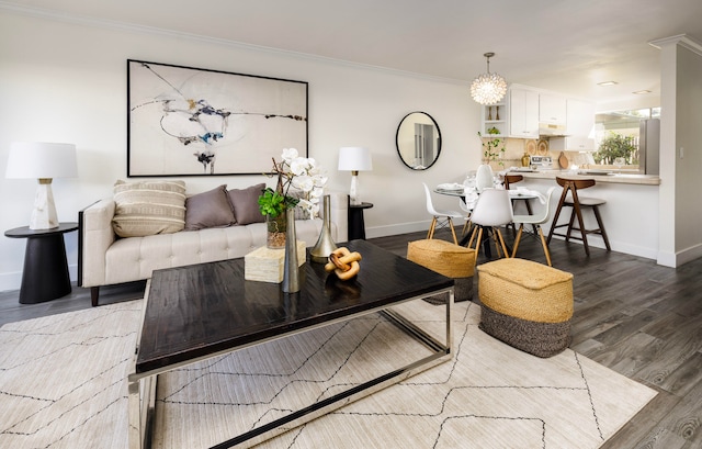 living room with wood-type flooring and crown molding