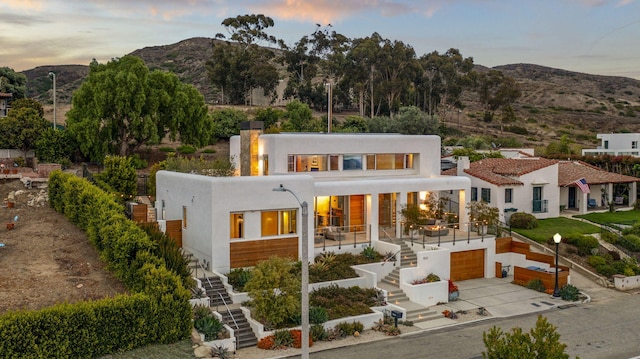 view of front of home featuring a mountain view and a garage