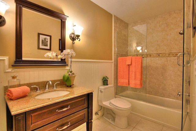 full bathroom with tile patterned floors, vanity, toilet, and combined bath / shower with glass door