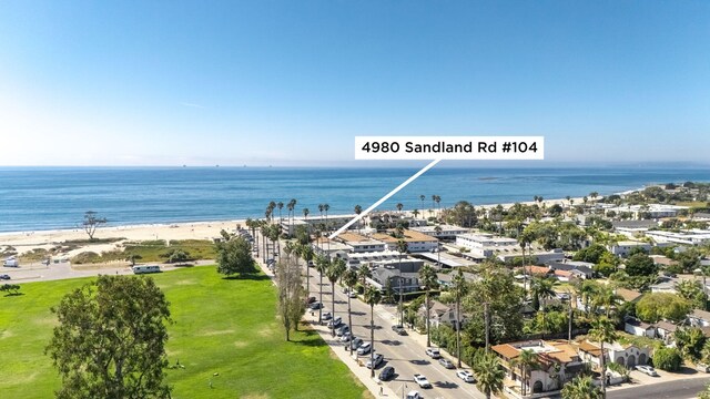 bird's eye view with a beach view and a water view