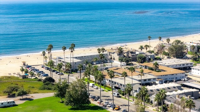 aerial view with a water view and a view of the beach