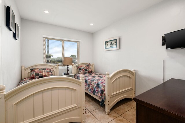 bedroom with light tile patterned flooring