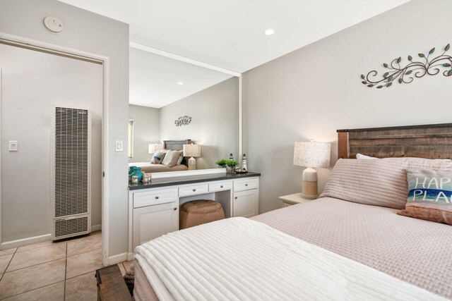 4980 Sandyland Rd Unit 104, Carpinteria, CA 93013 - bedroom with a heating unit, light tile patterned floors, recessed lighting, and baseboards