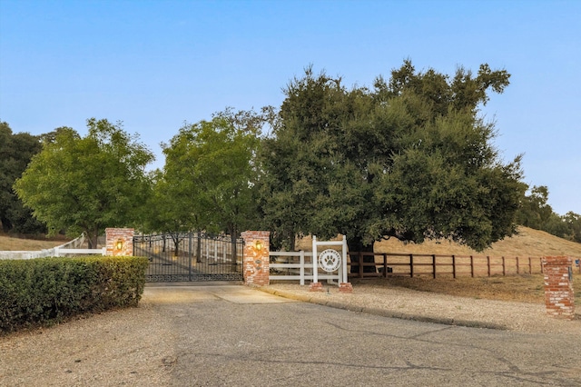 view of gate featuring a rural view