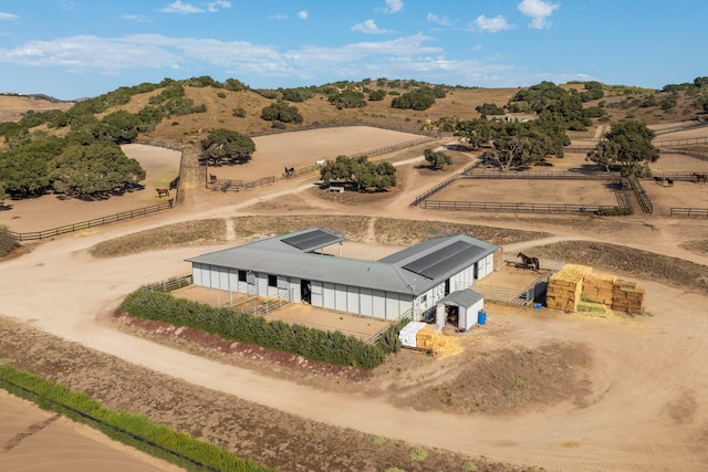 birds eye view of property featuring a rural view