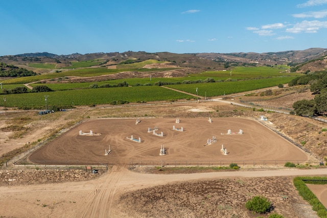 birds eye view of property featuring a mountain view and a rural view