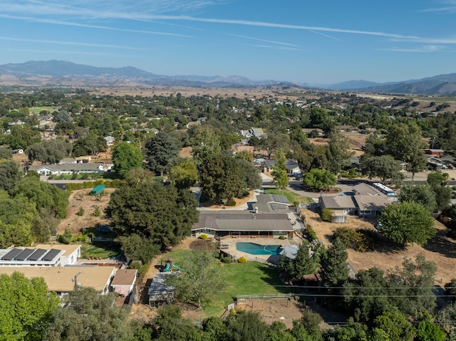 birds eye view of property with a mountain view