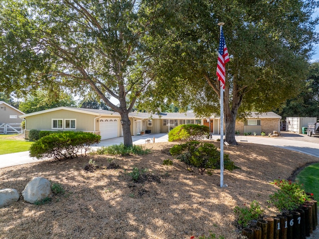 single story home with a garage