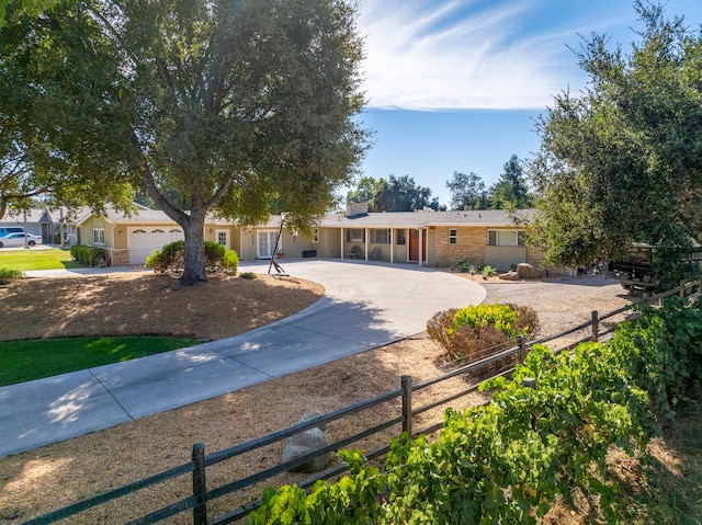 single story home featuring a garage