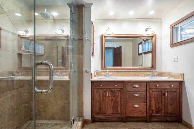 bathroom featuring vanity, tile patterned floors, ornamental molding, and an enclosed shower