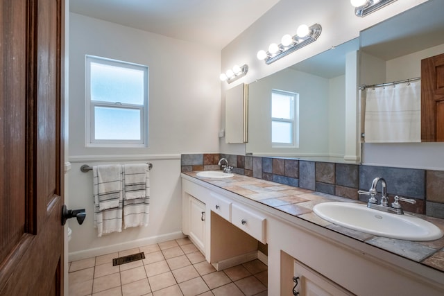 bathroom featuring vanity, tasteful backsplash, and tile patterned floors