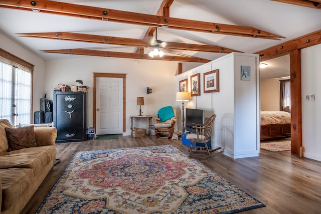 living room featuring dark hardwood / wood-style floors, lofted ceiling with beams, and ceiling fan