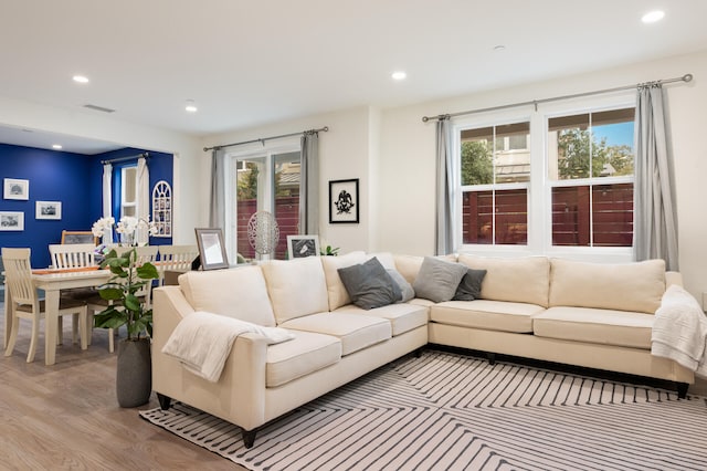 living room with light hardwood / wood-style flooring