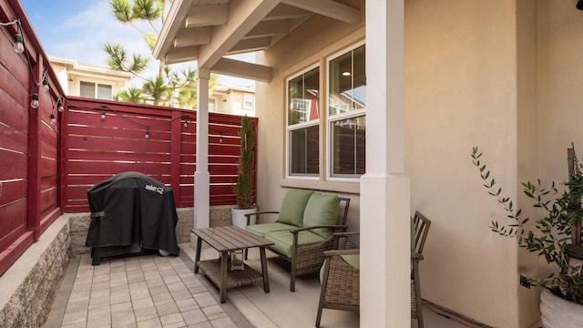 view of patio / terrace featuring outdoor lounge area and a grill