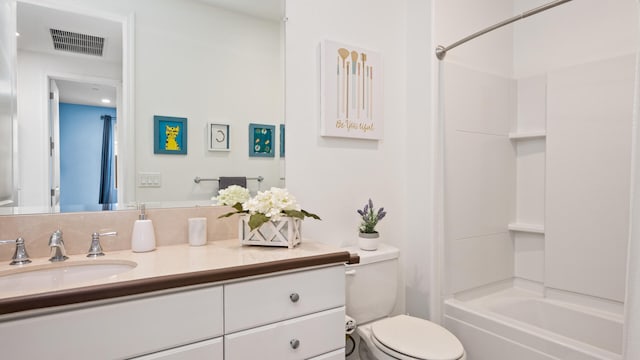 full bathroom with vanity, washtub / shower combination, and toilet