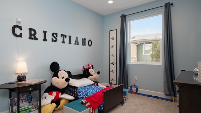 bedroom with light carpet