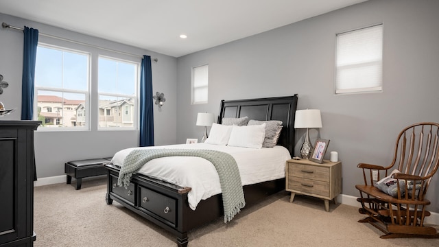 bedroom featuring light colored carpet