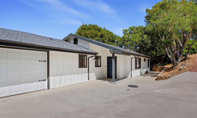 view of property exterior with a garage