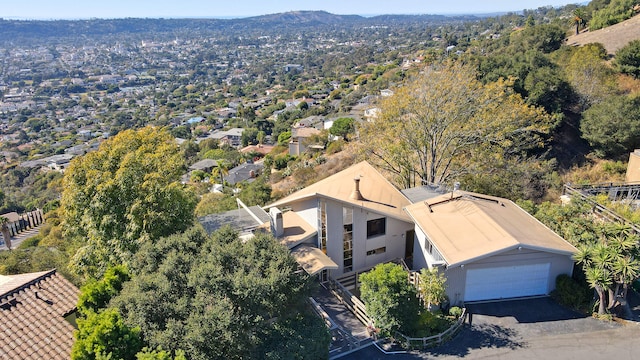 birds eye view of property with a mountain view