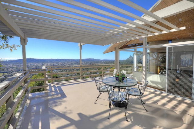 view of patio with outdoor dining area and a pergola