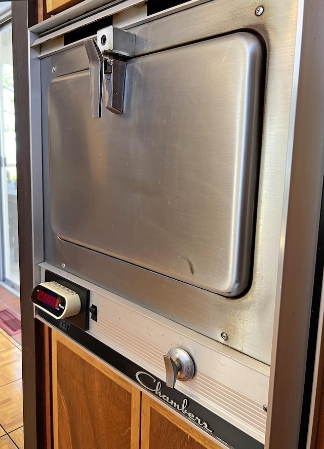 interior details featuring brown cabinetry and dark countertops