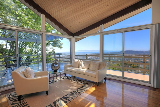 sunroom featuring vaulted ceiling